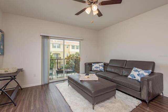 5520 White Marlin Ct, New Port Richey, FL 34652 - living room featuring dark wood-style floors, baseboards, and ceiling fan