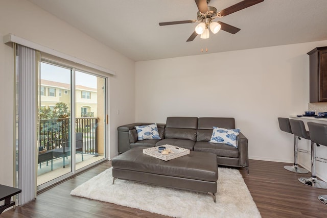5520 White Marlin Ct, New Port Richey, FL 34652 - living room featuring dark wood-style floors, ceiling fan, and baseboards