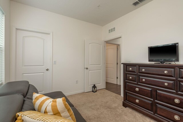 5520 White Marlin Ct, New Port Richey, FL 34652 - sitting room with light carpet and baseboards