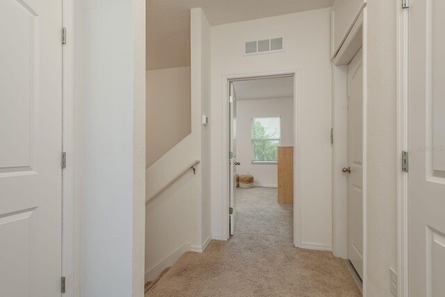 5520 White Marlin Ct, New Port Richey, FL 34652 - corridor featuring light carpet and baseboards