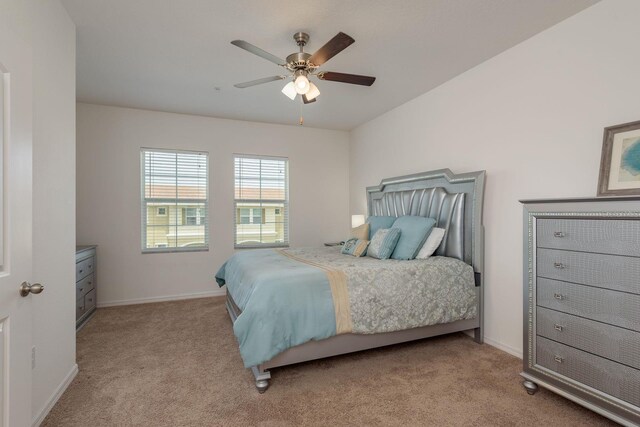 5520 White Marlin Ct, New Port Richey, FL 34652 - bedroom with light colored carpet, baseboards, and a ceiling fan