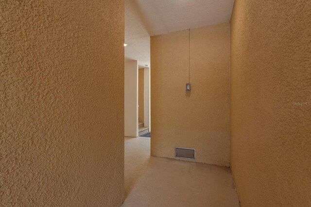 5520 White Marlin Ct, New Port Richey, FL 34652 - corridor with a textured wall