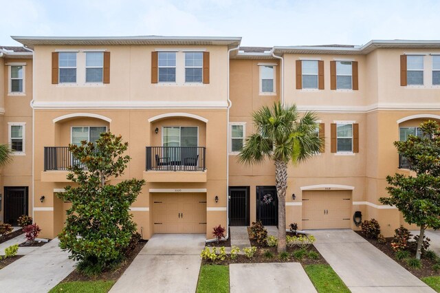 5520 White Marlin Ct, New Port Richey, FL 34652 - multi unit property featuring stucco siding, driveway, and a garage