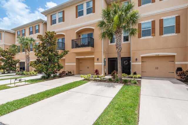 5520 White Marlin Ct, New Port Richey, FL 34652 - multi unit property featuring an attached garage, stucco siding, and driveway