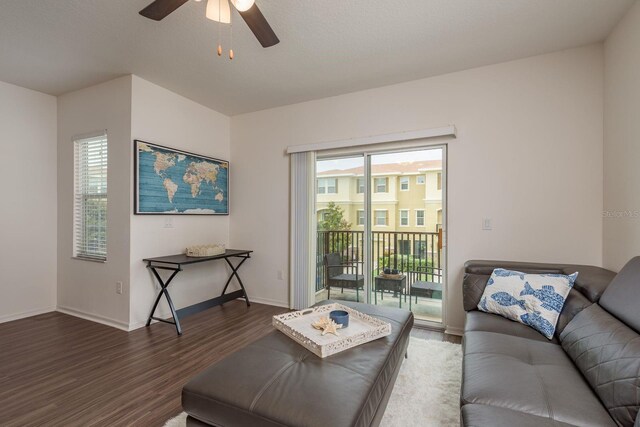 5520 White Marlin Ct, New Port Richey, FL 34652 - living room featuring wood finished floors, a ceiling fan, and baseboards