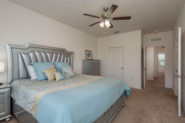 5520 White Marlin Ct, New Port Richey, FL 34652 - bedroom featuring light carpet, baseboards, and a ceiling fan