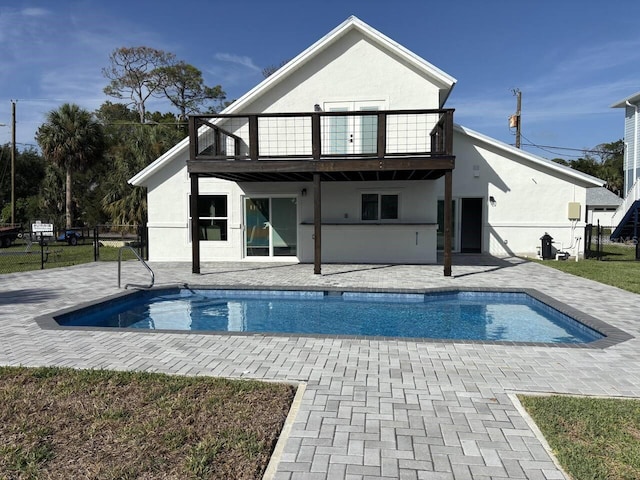 4104 Pine Dale Ct, Hernando Beach, FL 34607 - back of house with a balcony, a patio area, and stucco siding