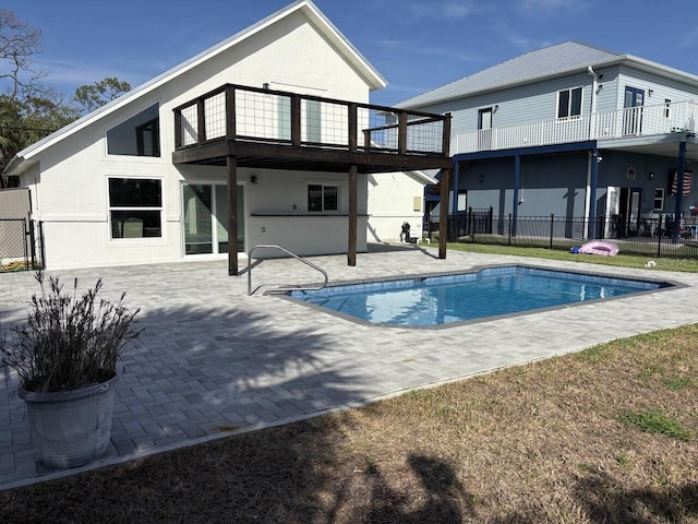 4104 Pine Dale Ct, Hernando Beach, FL 34607 - rear view of property with a balcony, a patio, and stucco siding