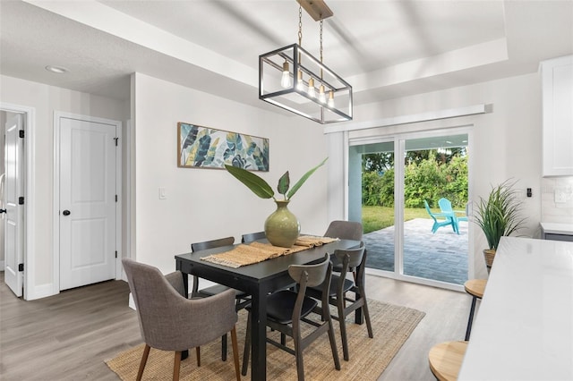 4479 Bluewater Ave, Spring Hill, FL 34606 - dining room with light wood-type flooring and baseboards