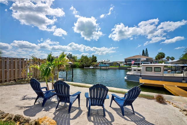4469 Bahama Dr, Hernando Beach, FL 34607 - view of patio / terrace with a water view and a dock