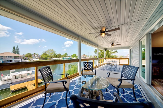 4469 Bahama Dr, Hernando Beach, FL 34607 - wooden deck with outdoor dining space and a ceiling fan