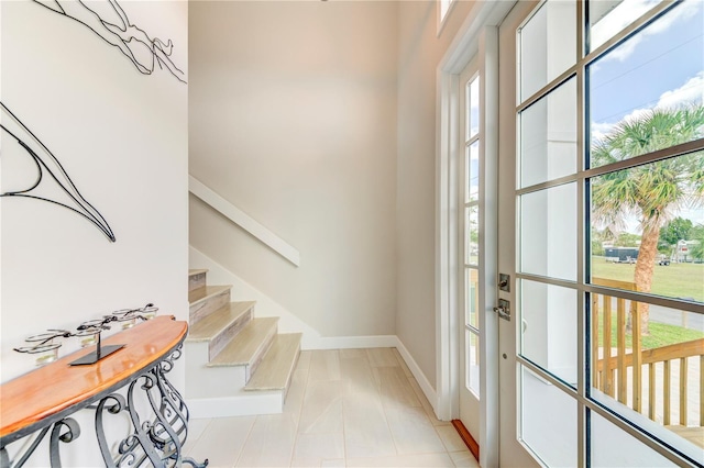 4469 Bahama Dr, Hernando Beach, FL 34607 - entryway featuring baseboards, stairway, and light tile patterned floors