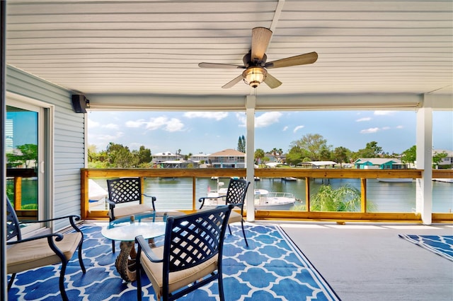 4469 Bahama Dr, Hernando Beach, FL 34607 - sunroom / solarium with a ceiling fan, a water view, and plenty of natural light