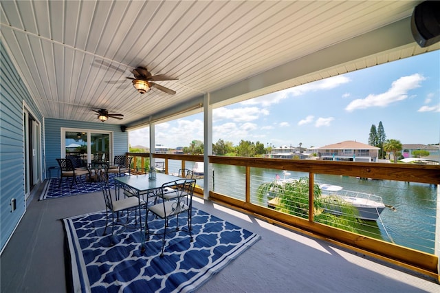4469 Bahama Dr, Hernando Beach, FL 34607 - sunroom / solarium with outdoor dining space, a water view, ceiling fan, and wood ceiling