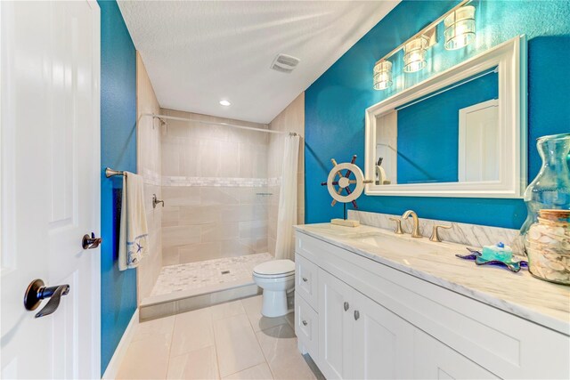 4469 Bahama Dr, Hernando Beach, FL 34607 - full bath with toilet, tiled shower, vanity, tile patterned flooring, and recessed lighting