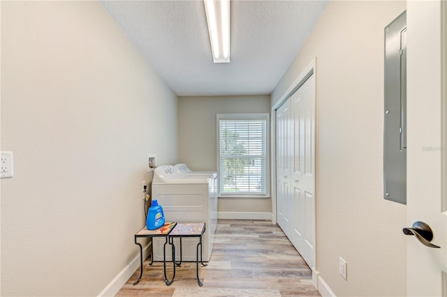 4469 Bahama Dr, Hernando Beach, FL 34607 - laundry room featuring washer and dryer, wood finished floors, and baseboards