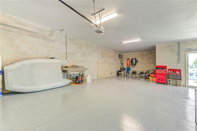 4469 Bahama Dr, Hernando Beach, FL 34607 - garage featuring a garage door opener and concrete block wall