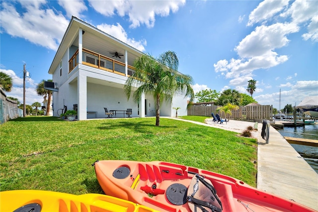 4469 Bahama Dr, Hernando Beach, FL 34607 - back of property with ceiling fan, a balcony, a patio area, and stucco siding