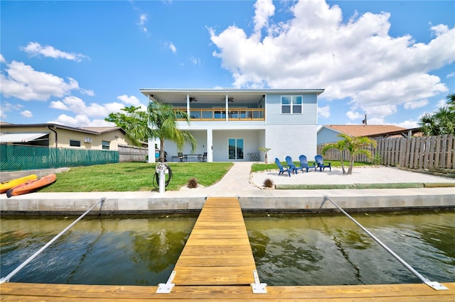 4469 Bahama Dr, Hernando Beach, FL 34607 - back of property featuring a balcony, a patio, and a water view