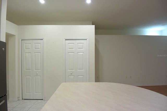 14112 Whitecap Ave, Hudson, FL 34667 - bedroom featuring two closets, recessed lighting, baseboards, and light tile patterned floors
