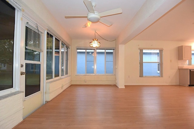 14112 Whitecap Ave, Hudson, FL 34667 - unfurnished sunroom with wood finished floors and baseboards