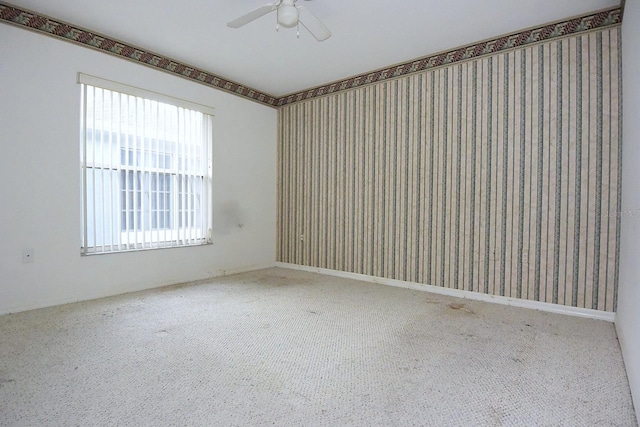 14112 Whitecap Ave, Hudson, FL 34667 - carpeted spare room featuring ceiling fan and wallpapered walls