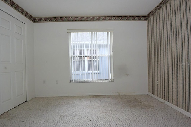 14112 Whitecap Ave, Hudson, FL 34667 - unfurnished bedroom with carpet floors and baseboards