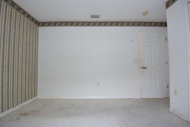 14112 Whitecap Ave, Hudson, FL 34667 - carpeted empty room featuring wallpapered walls and baseboards