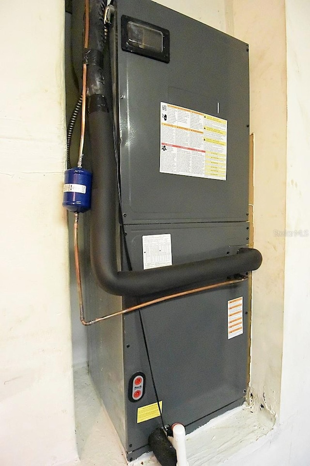 14112 Whitecap Ave, Hudson, FL 34667 - utility room with heating unit