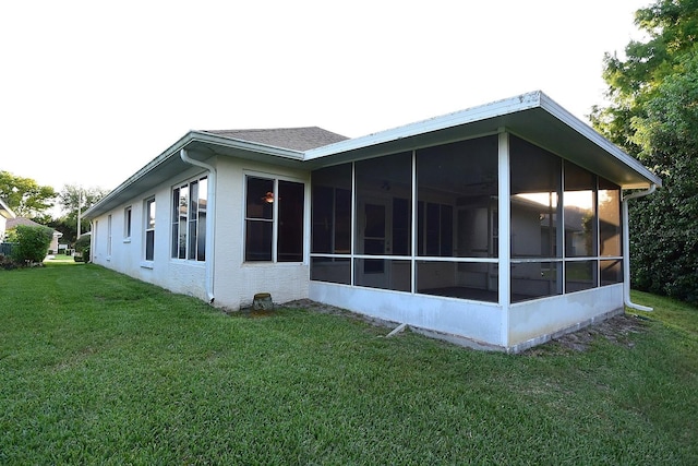 14112 Whitecap Ave, Hudson, FL 34667 - view of home's exterior with a yard and a sunroom