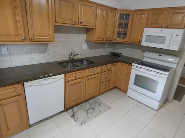 13010 Wedgewood Way Unit A, Hudson, FL 34667 - kitchen featuring white appliances, a sink, backsplash, and dark stone countertops