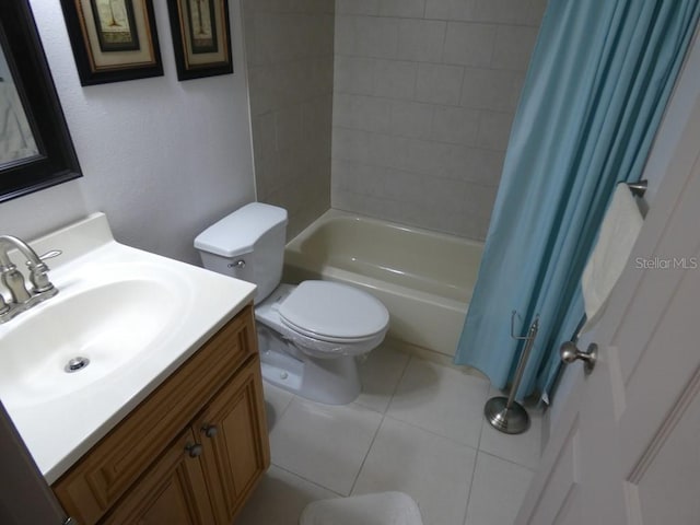 13010 Wedgewood Way Unit A, Hudson, FL 34667 - bathroom with shower / bath combo with shower curtain, toilet, vanity, and tile patterned floors