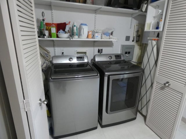 13010 Wedgewood Way Unit A, Hudson, FL 34667 - laundry room featuring washer and clothes dryer and light tile patterned flooring