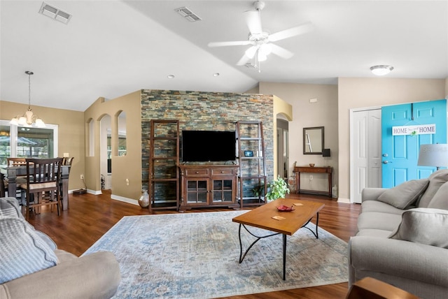 13444 English Parrot Rd, Brooksville, FL 34614 - living room with lofted ceiling, ceiling fan, wood finished floors, a chandelier, and baseboards