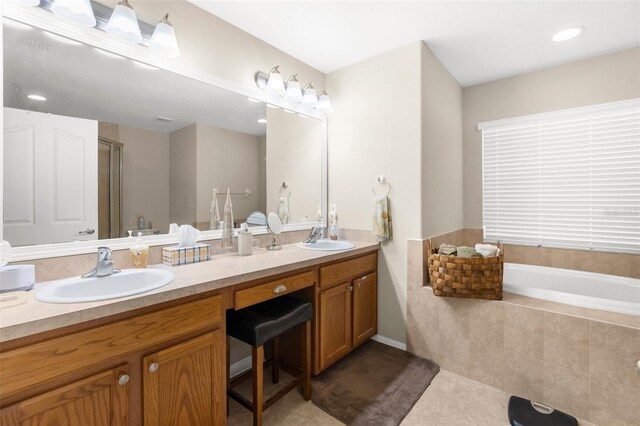 13444 English Parrot Rd, Brooksville, FL 34614 - bathroom featuring double vanity, tile patterned flooring, a garden tub, and an enclosed shower