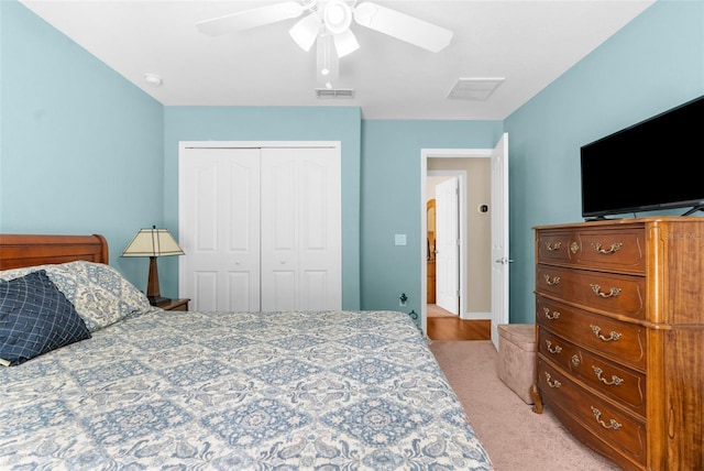 13444 English Parrot Rd, Brooksville, FL 34614 - bedroom with a closet, a ceiling fan, and light colored carpet