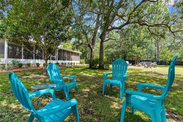 13444 English Parrot Rd, Brooksville, FL 34614 - view of green lawn with a sunroom