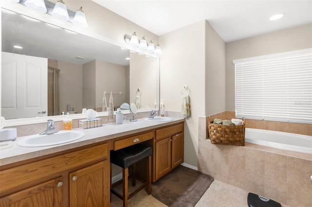 13444 English Parrot Rd, Brooksville, FL 34614 - full bath featuring tile patterned floors, double vanity, a bath, and an enclosed shower