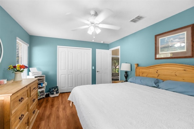 13444 English Parrot Rd, Brooksville, FL 34614 - bedroom with dark wood finished floors, a closet, and ceiling fan