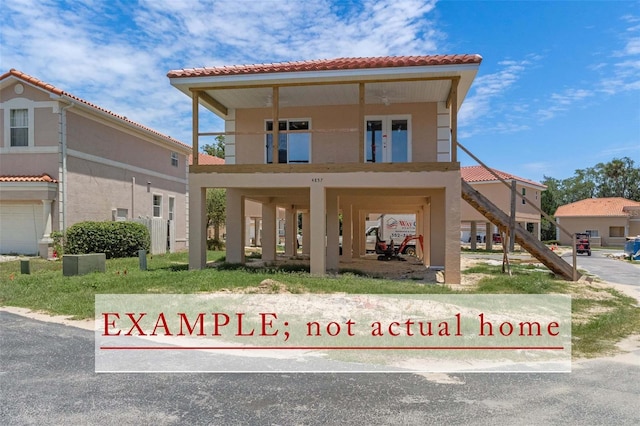 10234 W Middlburg Loop Unit 152, Homosassa, FL 34448 - view of front of home featuring stucco siding and a tiled roof