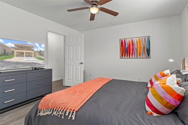 10234 W Middlburg Loop Unit 152, Homosassa, FL 34448 - bedroom with wood finished floors and a ceiling fan