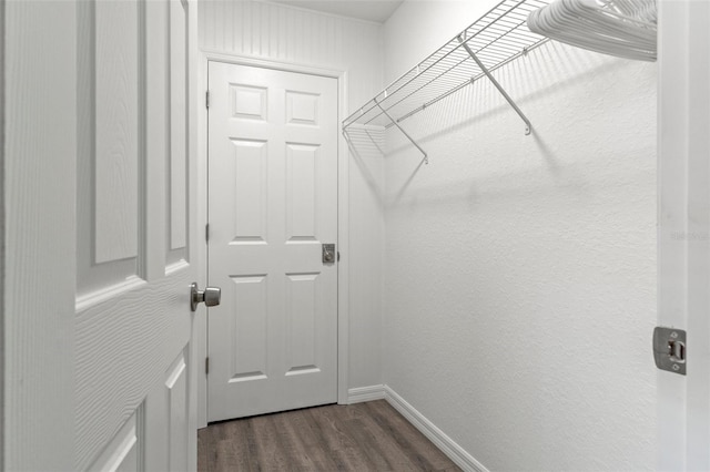 10234 W Middlburg Loop Unit 152, Homosassa, FL 34448 - walk in closet featuring dark wood finished floors