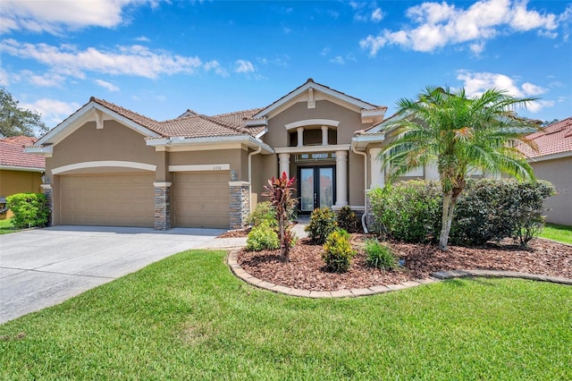 11726 Belle Haven Dr, New Port Richey, FL 34654 - view of front of home with stucco siding, french doors, a garage, driveway, and a front lawn