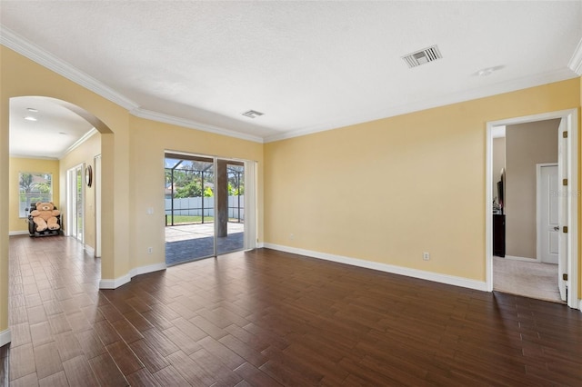 11726 Belle Haven Dr, New Port Richey, FL 34654 - spare room with dark wood-style floors, arched walkways, ornamental molding, and baseboards