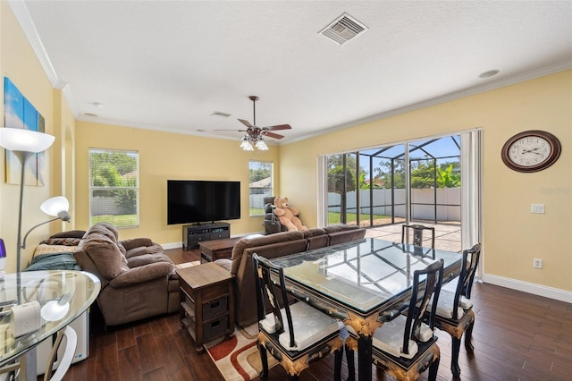 11726 Belle Haven Dr, New Port Richey, FL 34654 - living room with crown molding, dark wood-style floors, baseboards, and ceiling fan