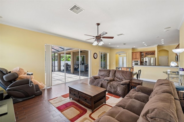 11726 Belle Haven Dr, New Port Richey, FL 34654 - living area with arched walkways, light wood-type flooring, a ceiling fan, crown molding, and recessed lighting