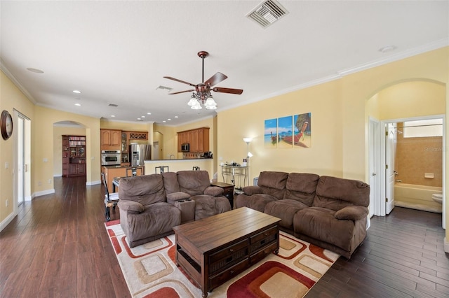 11726 Belle Haven Dr, New Port Richey, FL 34654 - living area with arched walkways, ceiling fan, ornamental molding, dark wood-style flooring, and recessed lighting
