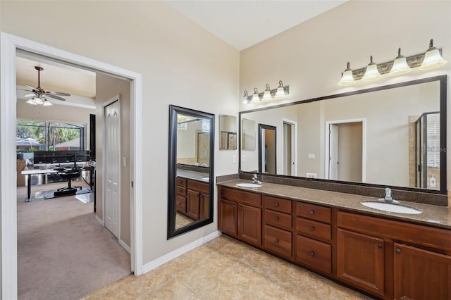 11726 Belle Haven Dr, New Port Richey, FL 34654 - bathroom featuring double vanity, a ceiling fan, a shower stall, baseboards, and tile patterned floors