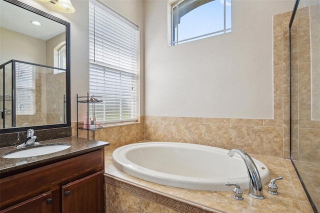 11726 Belle Haven Dr, New Port Richey, FL 34654 - bathroom with a garden tub, plenty of natural light, vanity, and a tile shower