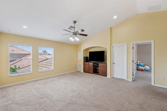 11726 Belle Haven Dr, New Port Richey, FL 34654 - unfurnished living room with light carpet, baseboards, a ceiling fan, high vaulted ceiling, and recessed lighting